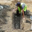 Archeolodzy odnaleźli już prawie sto trumien pod ulicą Warszawską!